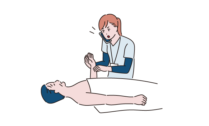 状態変化を起こした患者にアセスメントする看護師